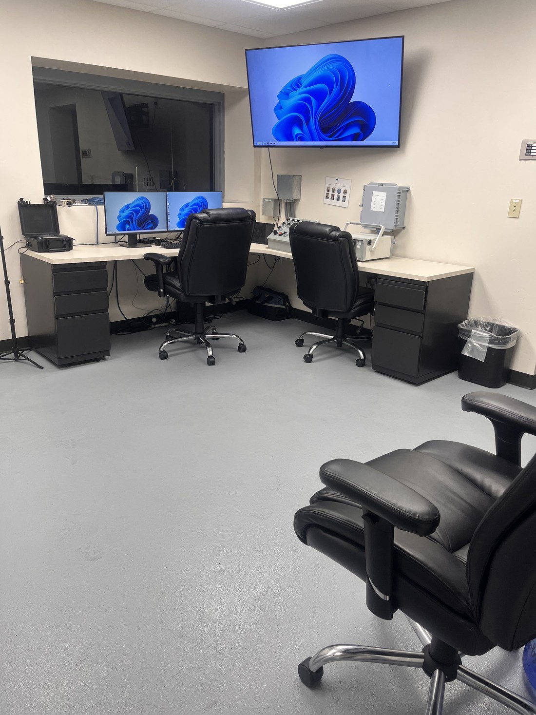 A plant control room with workstations and monitors, cleaned around live equipment